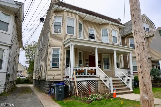 a front view of a house with a porch