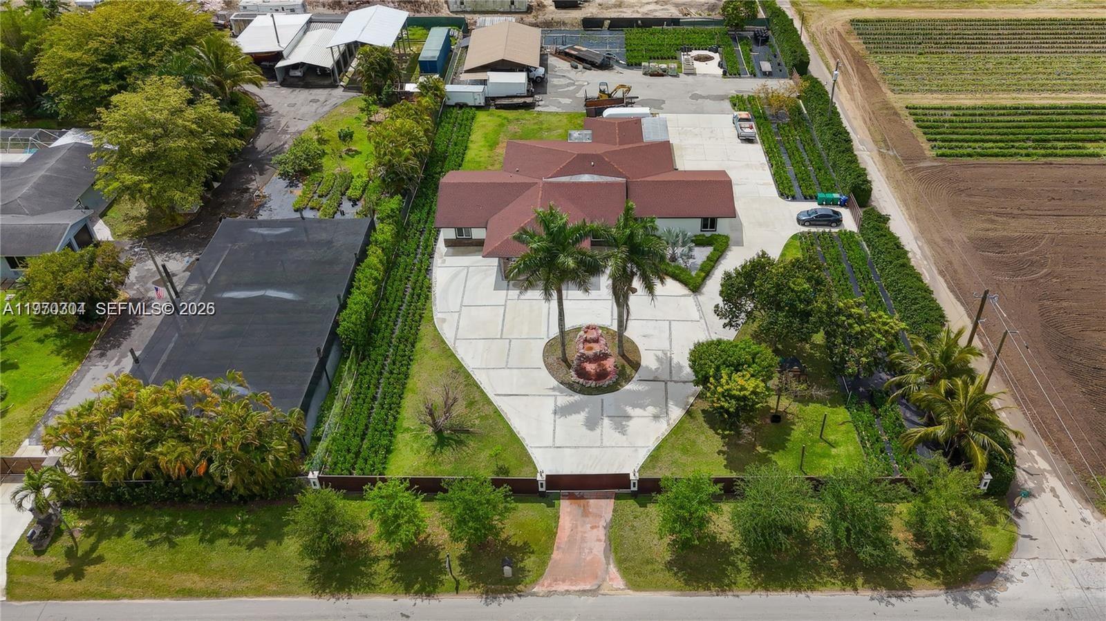 19390 Southwest 312th Street Homestead, FL 33030 - Photo 43 of 44 an aerial view of residential houses with outdoor space and street view