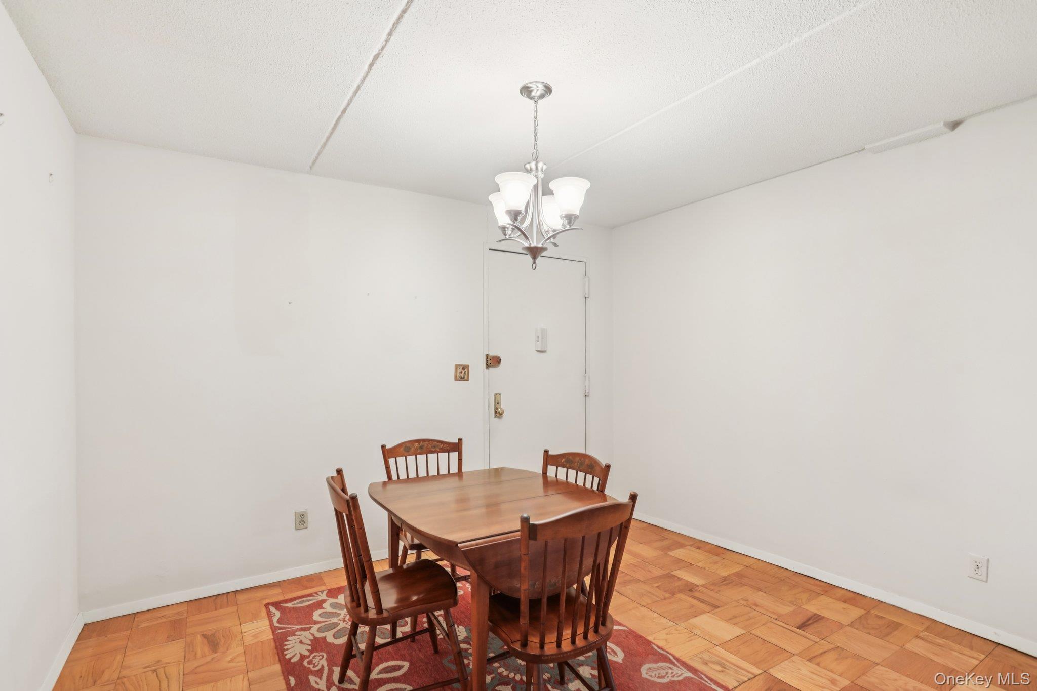 108 Sagamore Road, Unit 3E Tuckahoe, NY 10707 - Photo 11 of 30 a view of a dining room with a table and chairs