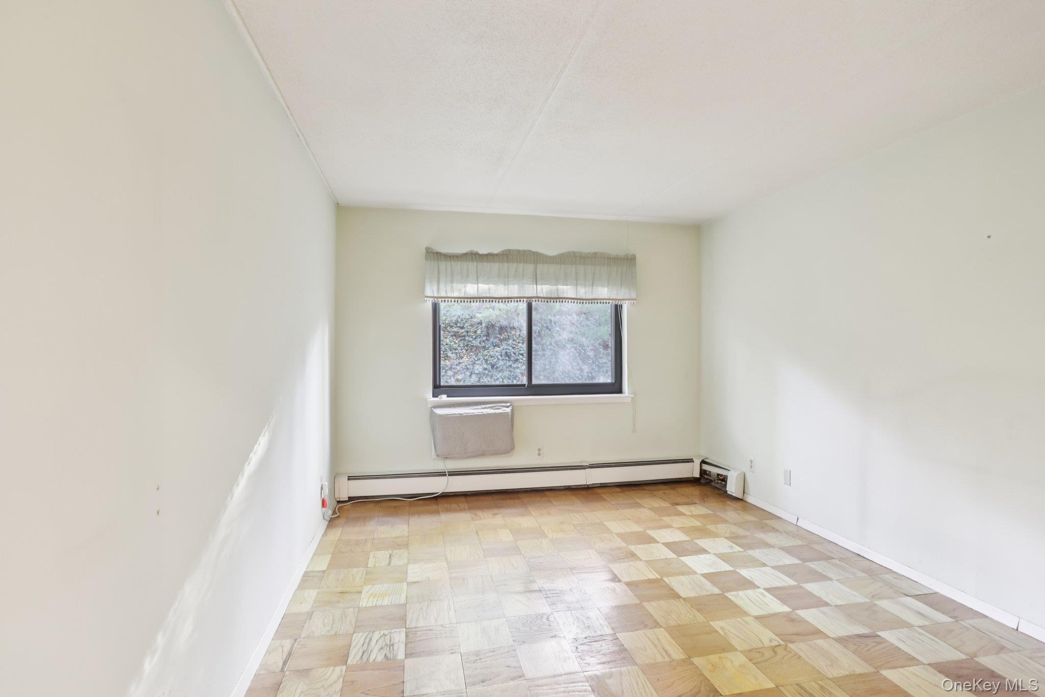 108 Sagamore Road, Unit 3E Tuckahoe, NY 10707 - Photo 18 of 30 an empty room with windows