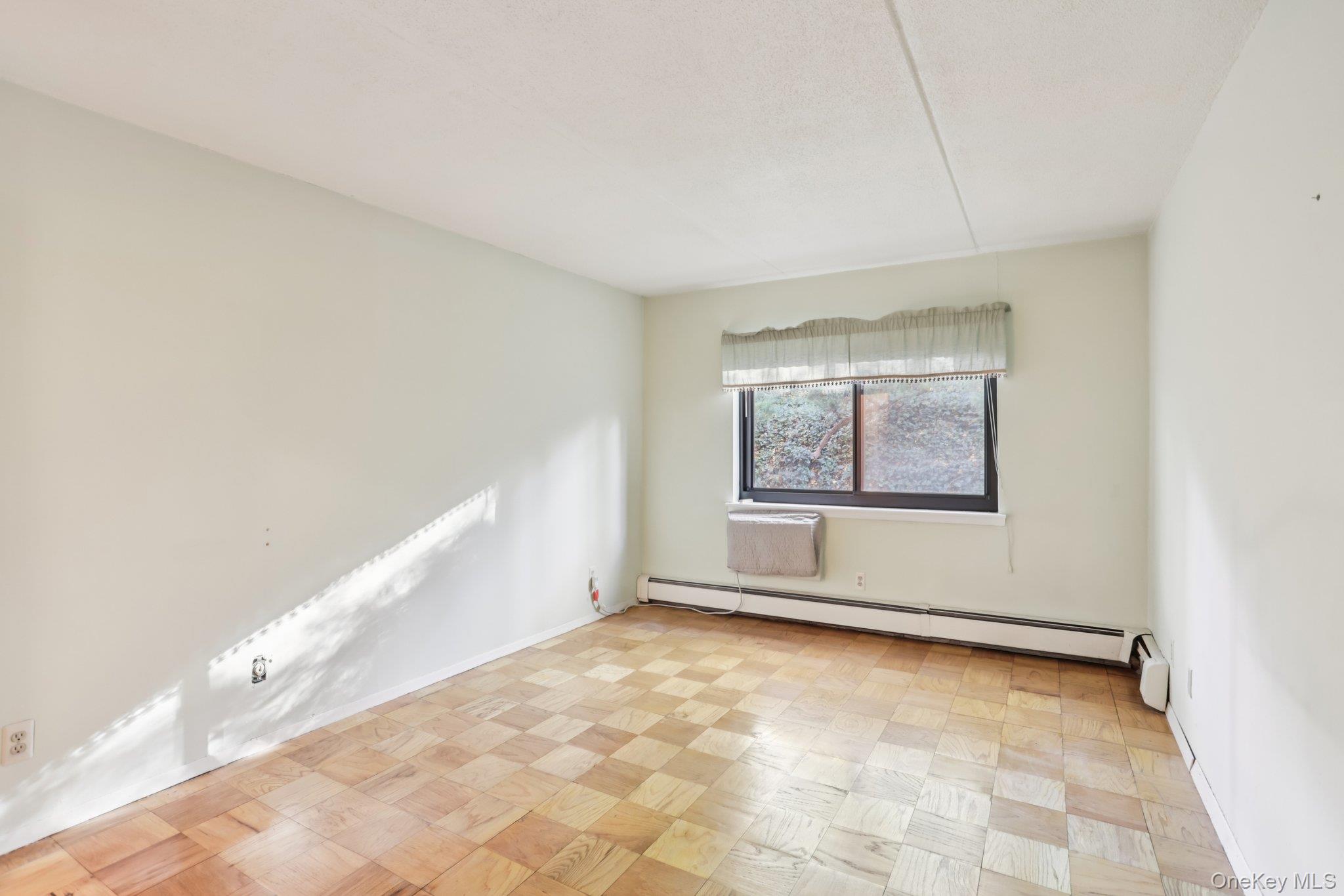 108 Sagamore Road, Unit 3E Tuckahoe, NY 10707 - Photo 19 of 30 an empty room with windows