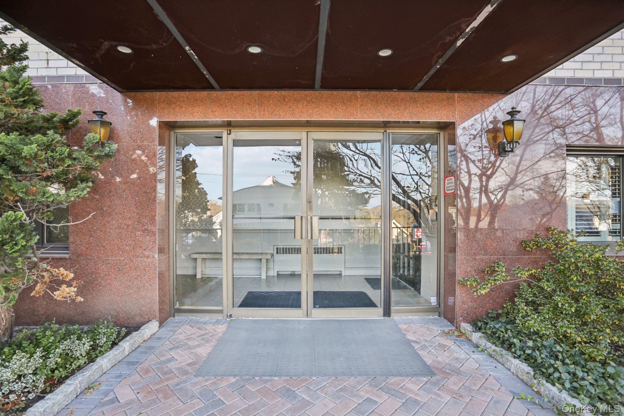108 Sagamore Road, Unit 3E Tuckahoe, NY 10707 - Photo 2 of 30 a view of a entryway with flower pots