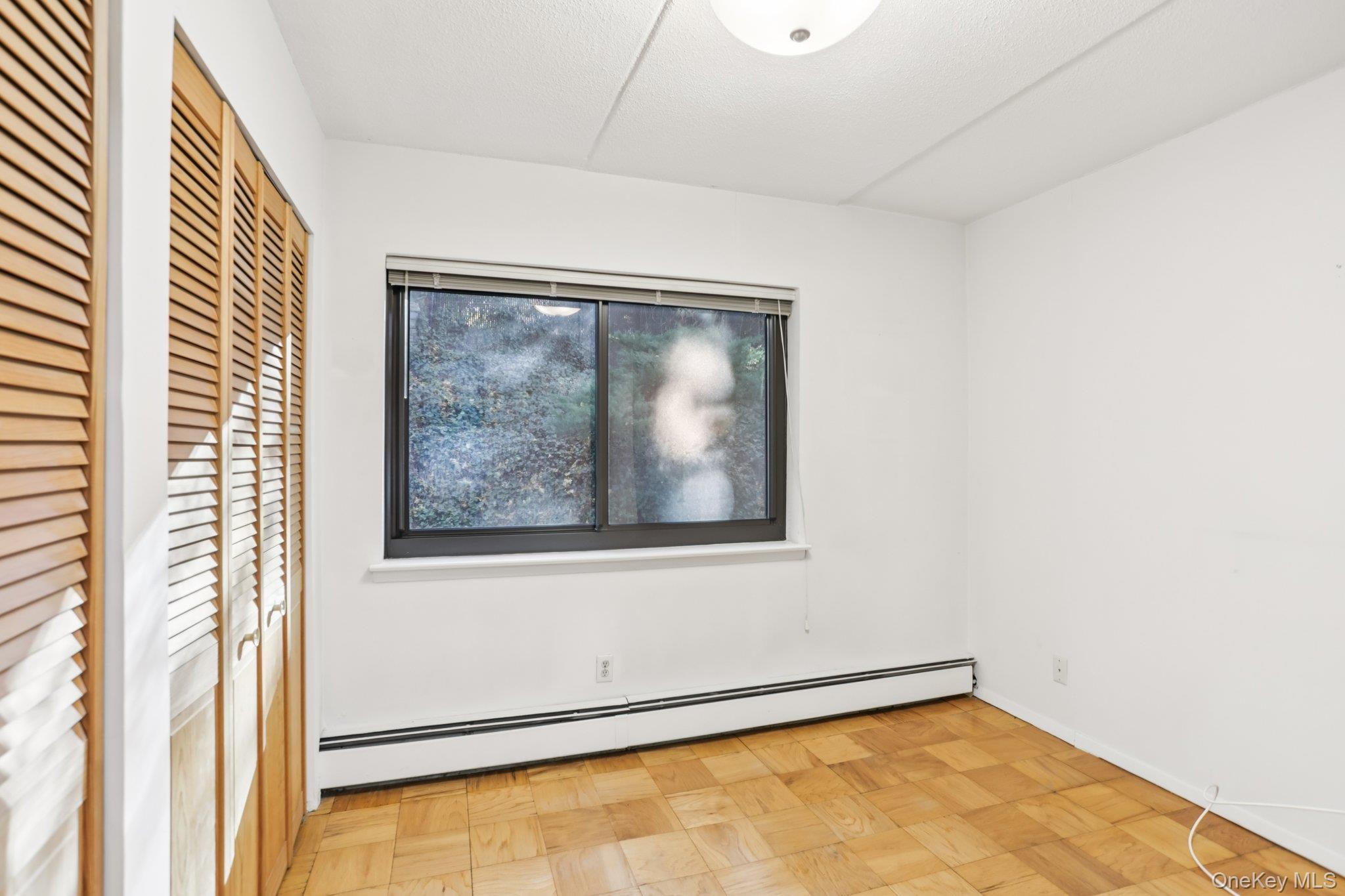 108 Sagamore Road, Unit 3E Tuckahoe, NY 10707 - Photo 24 of 30 an empty room with a window