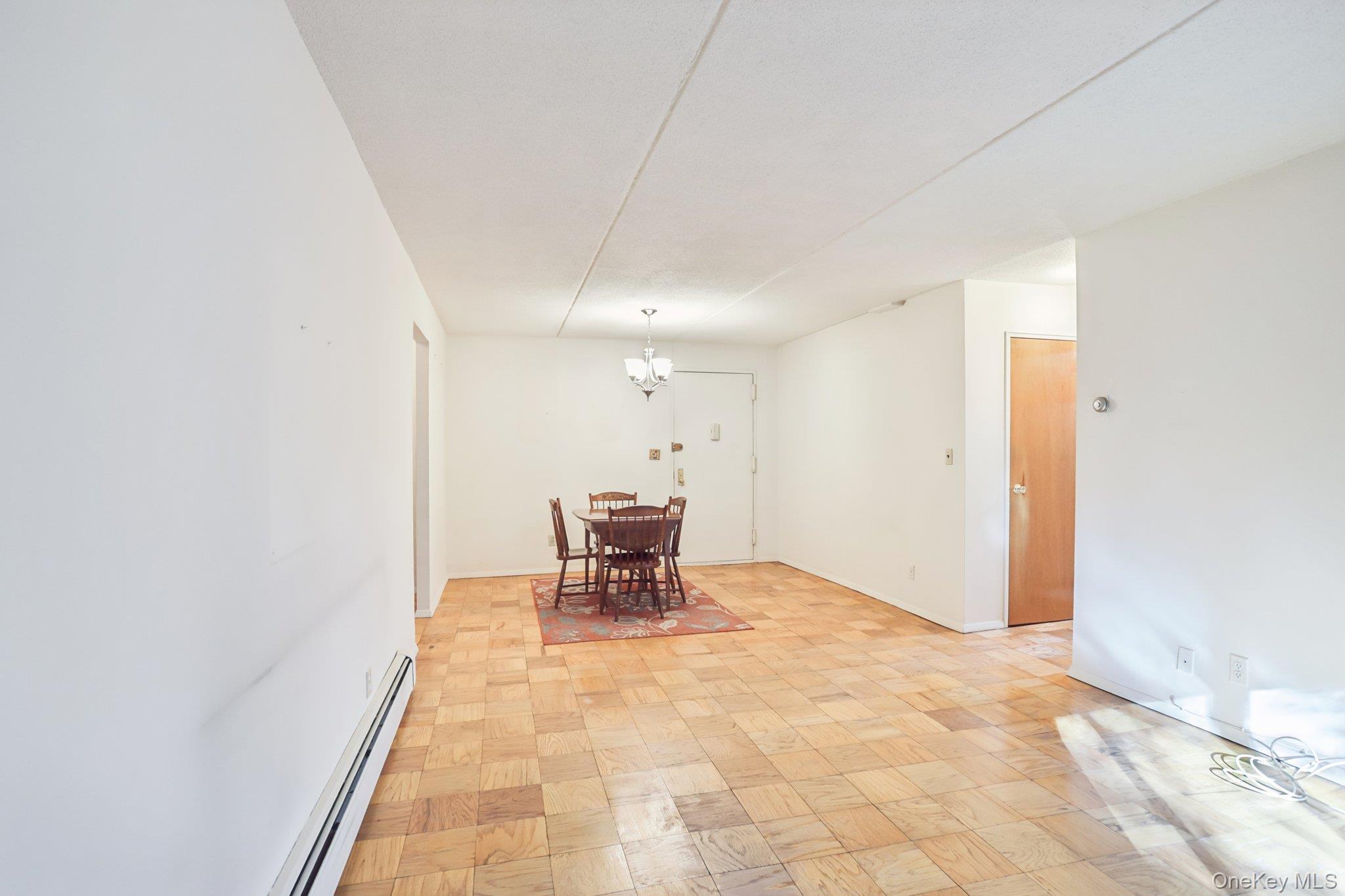 108 Sagamore Road, Unit 3E Tuckahoe, NY 10707 - Photo 7 of 30 an empty room with furniture and a window