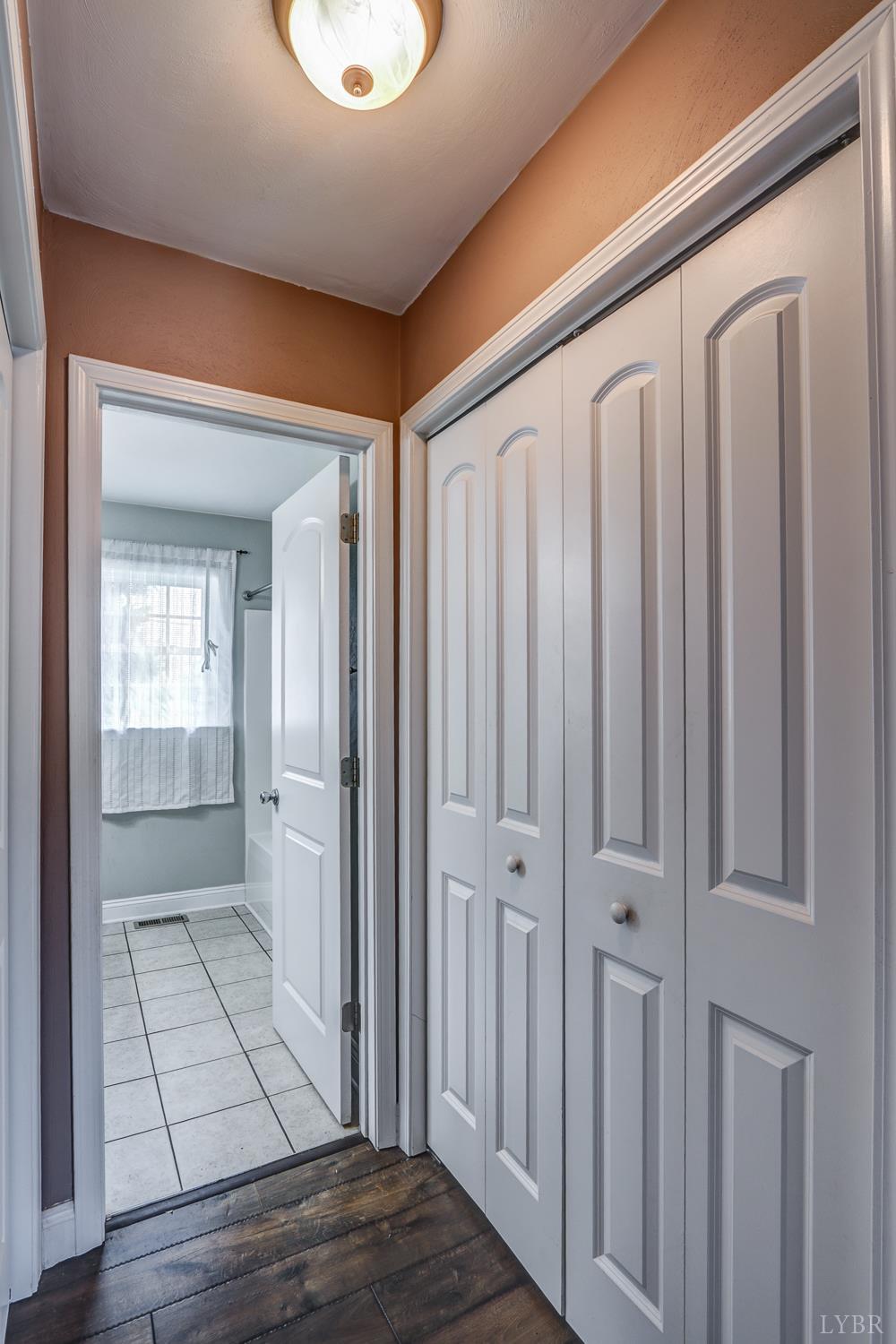 1057 Old Trail Road Forest, VA 24551 - Photo 32 of 49 a view of a hallway with wooden floor and staircase