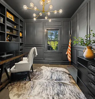 a kitchen with stainless steel appliances kitchen island granite countertop a sink a stove and a refrigerator