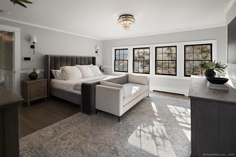 a spacious bathroom with a tub sink and mirror