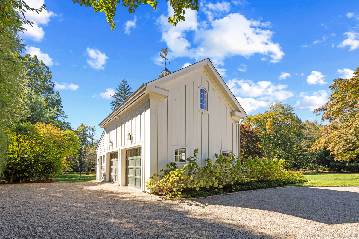 469 Brookside Road New Canaan, CT 06840 - Photo 25 of 40 a view of a house with backyard and garden