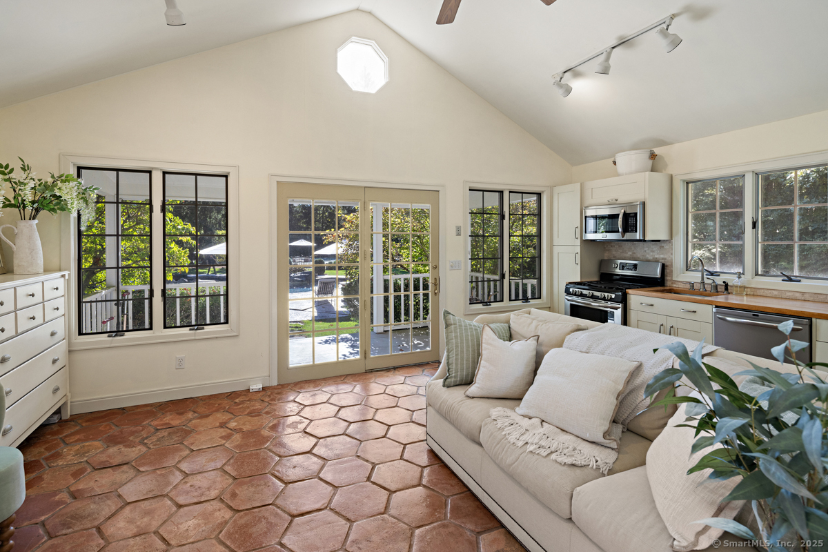 469 Brookside Road New Canaan, CT 06840 - Photo 29 of 40 a living room with furniture and a flat screen tv