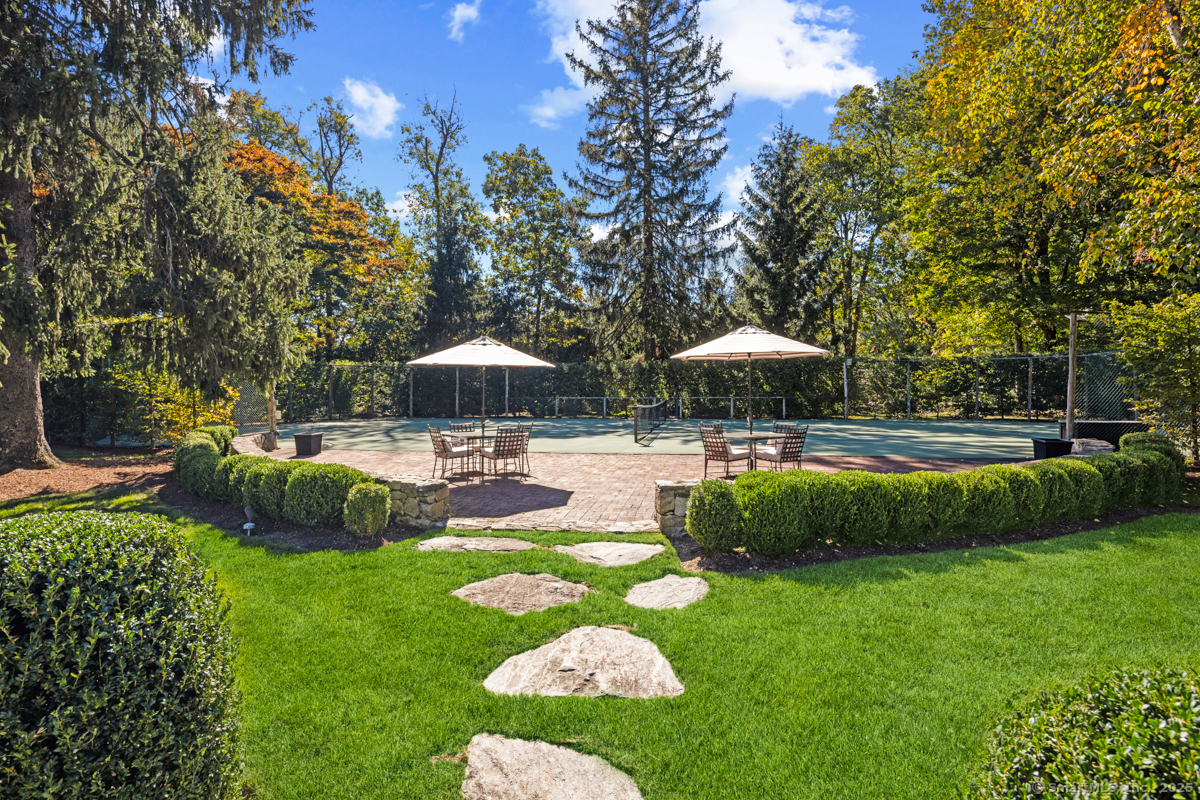 469 Brookside Road New Canaan, CT 06840 - Photo 31 of 40 a swimming pool with outdoor seating and yard