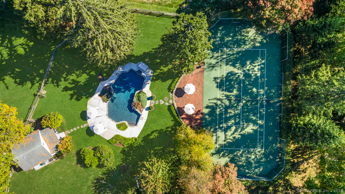 469 Brookside Road New Canaan, CT 06840 - Photo 32 of 40 an aerial view of a house with a yard and garden