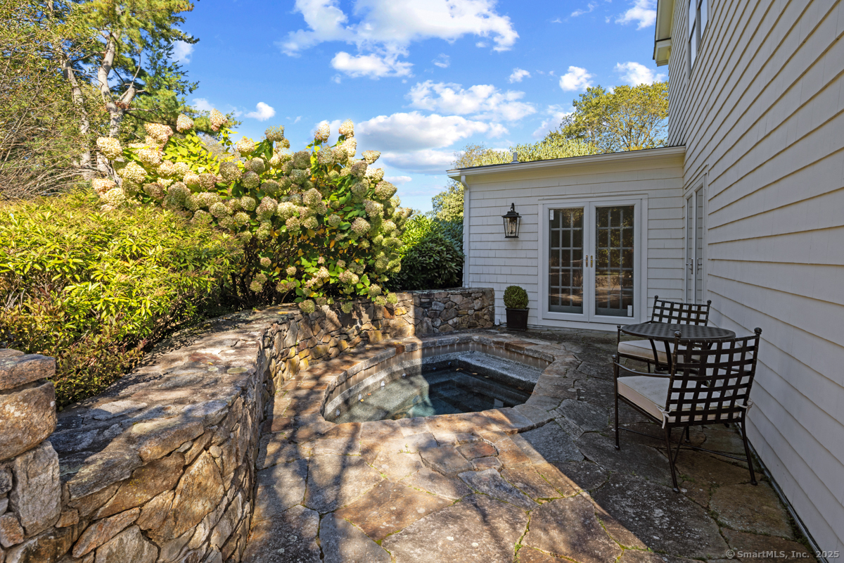 469 Brookside Road New Canaan, CT 06840 - Photo 36 of 40 a view of a back yard and patio