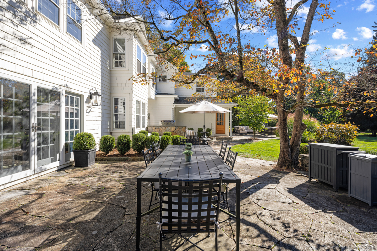 469 Brookside Road New Canaan, CT 06840 - Photo 37 of 40 a view of a swimming pool with a patio
