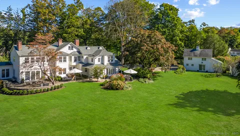 a view of a yard and front view of a house