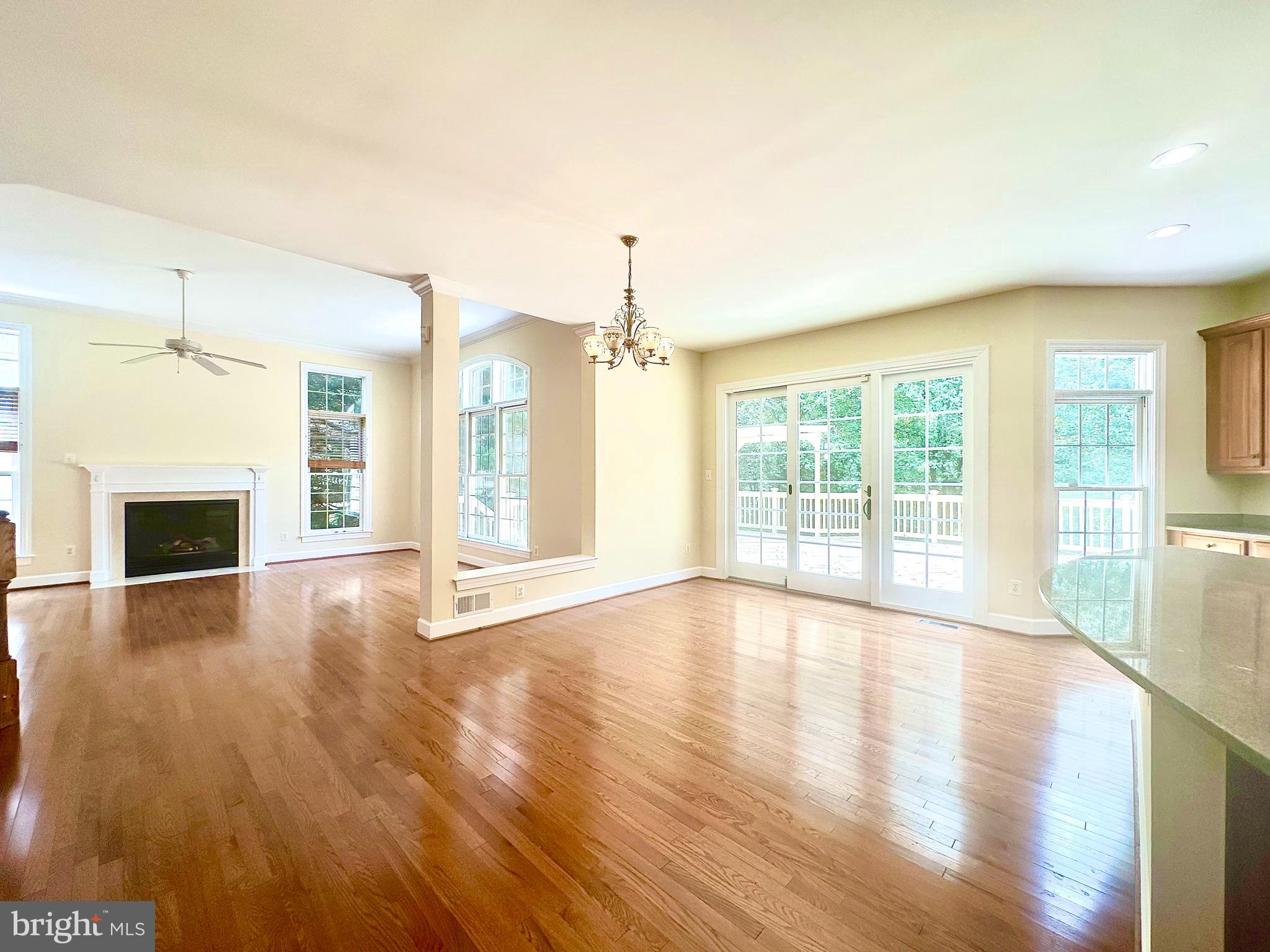 1460 Carrington Ridge Lane Vienna, VA 22182 - Photo 19 of 74 a view of an empty room with wooden floor and a window