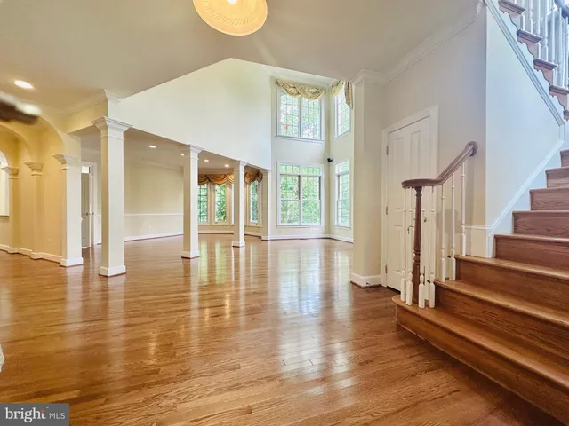 a view of an entryway with wooden floor