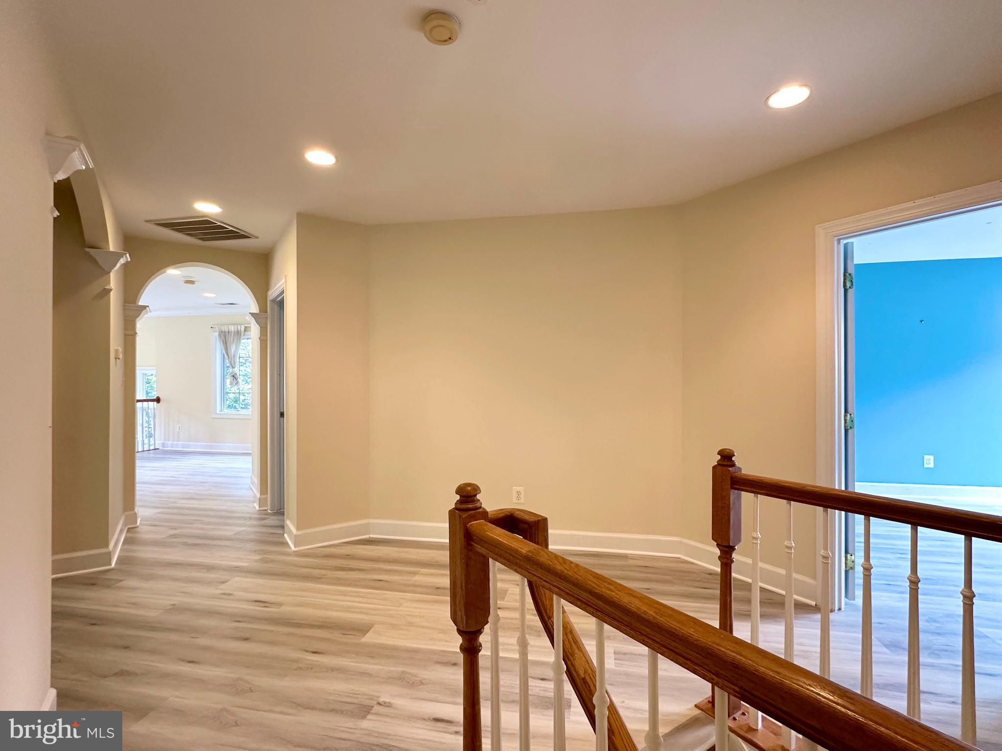 1460 Carrington Ridge Lane Vienna, VA 22182 - Photo 30 of 74 a view of a hallway with wooden floor