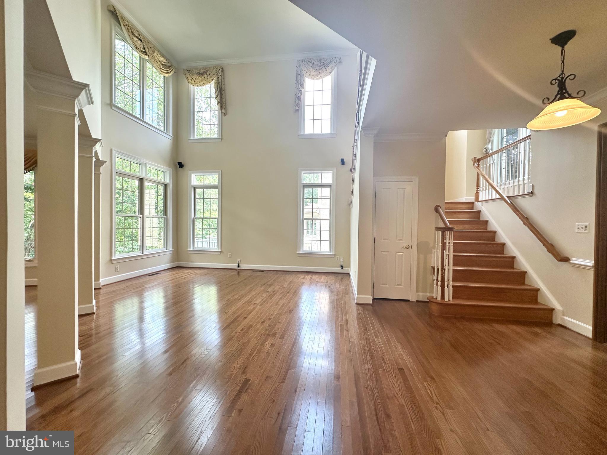 1460 Carrington Ridge Lane Vienna, VA 22182 - Photo 3 of 74 a view of an entryway with wooden floor and a window