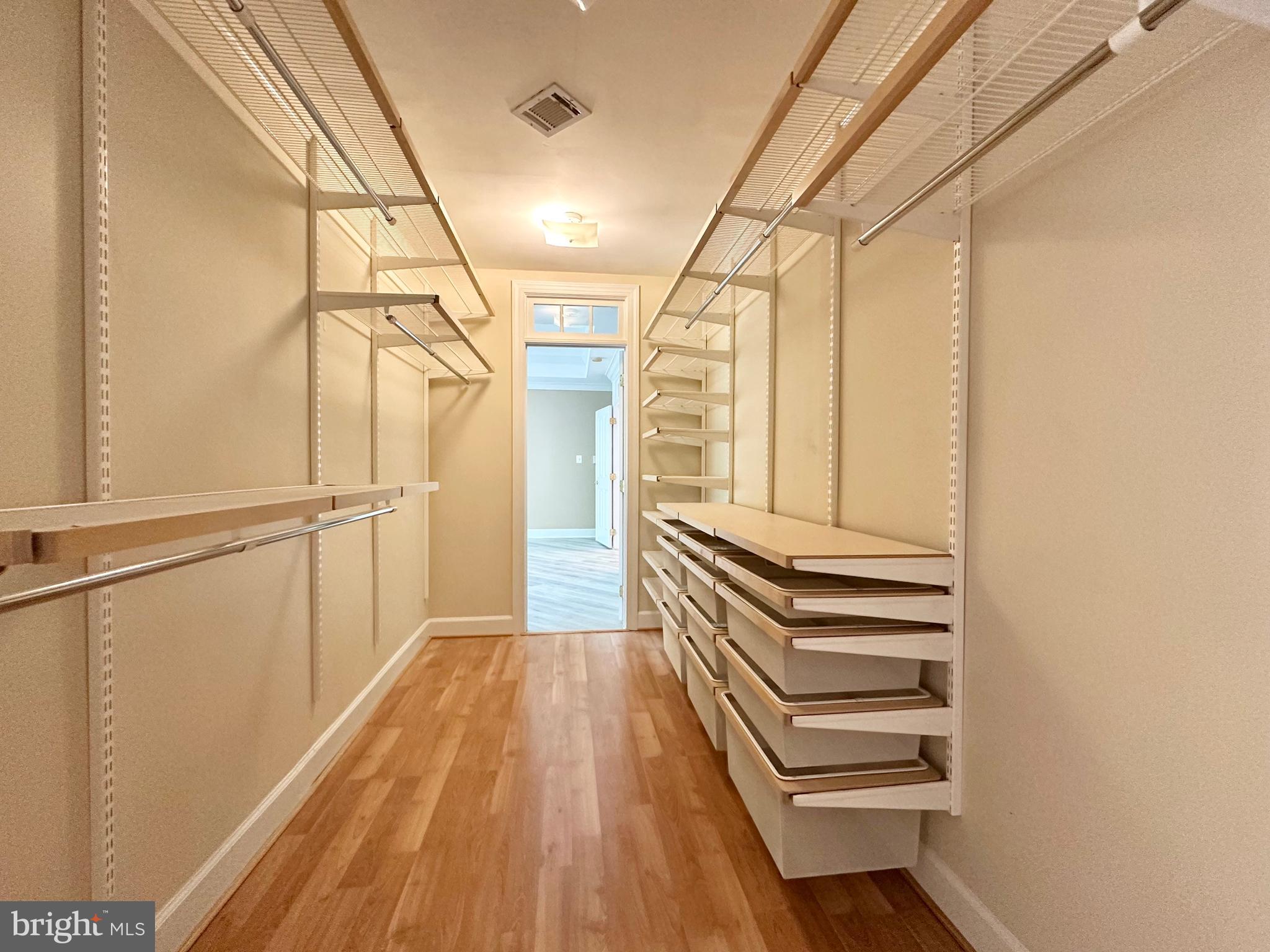 1460 Carrington Ridge Lane Vienna, VA 22182 - Photo 42 of 74 a view of a room with wooden floor and white walls