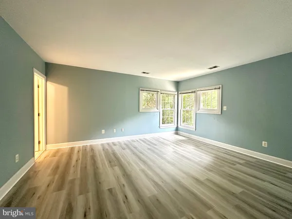 a kitchen with granite countertop a sink and a stove