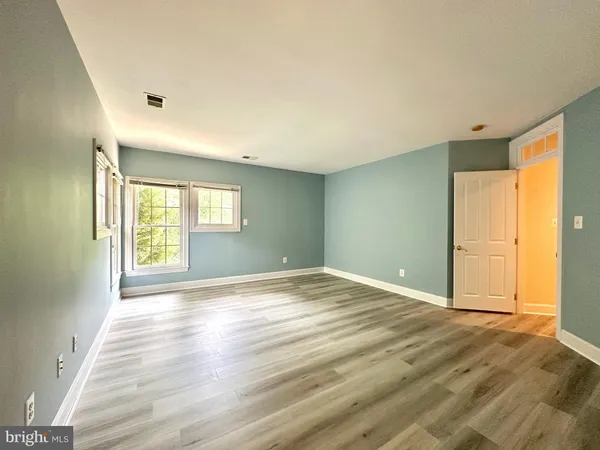 a kitchen with stainless steel appliances a sink stove and cabinets