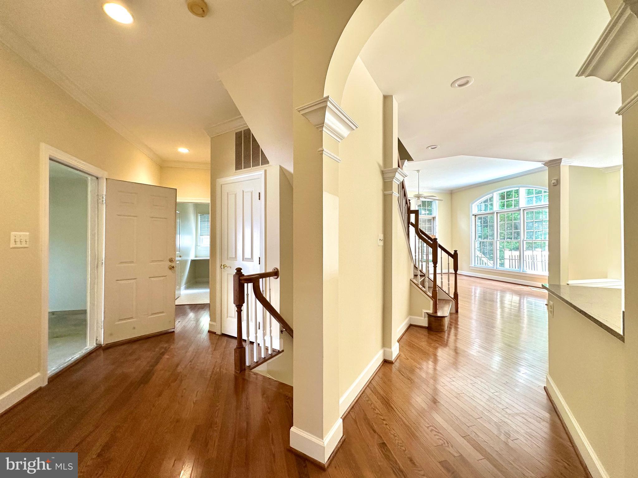 1460 Carrington Ridge Lane Vienna, VA 22182 - Photo 60 of 74 a view of a hallway view with wooden floor and staircase