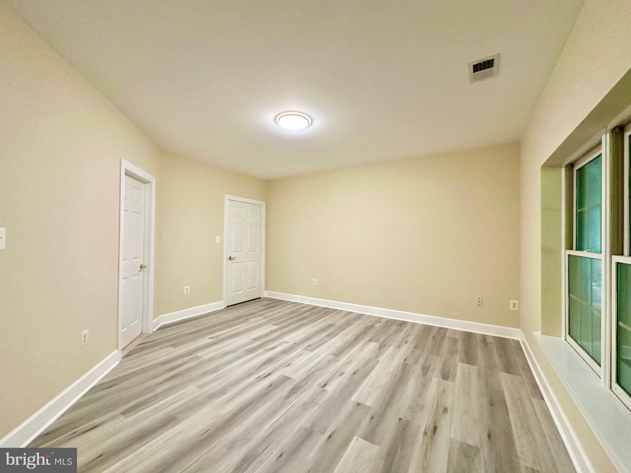 1460 Carrington Ridge Lane Vienna, VA 22182 - Photo 69 of 74 a view of an empty room with wooden floor