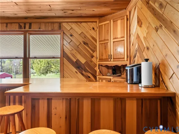 a view of an chairs and table on the wooden floor