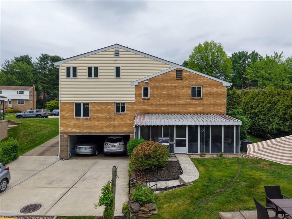 223 Amity Road Glenshaw, PA 15116 - Photo 2 of 42 View of the back of the home, garage and sunroom