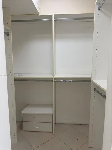 a view of a closet area in front of a house