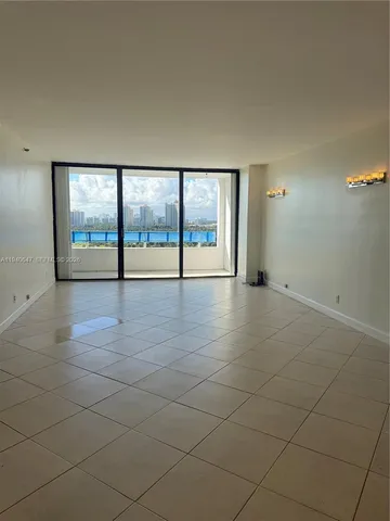 a kitchen with granite countertop a stove sink and cabinets