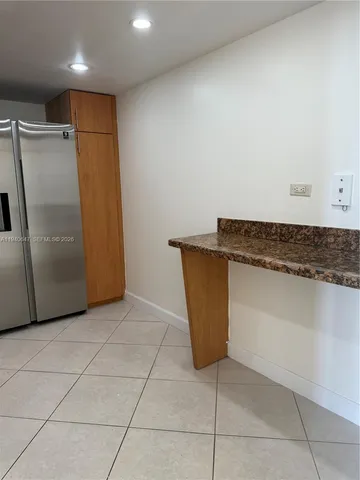 an empty room with a bench