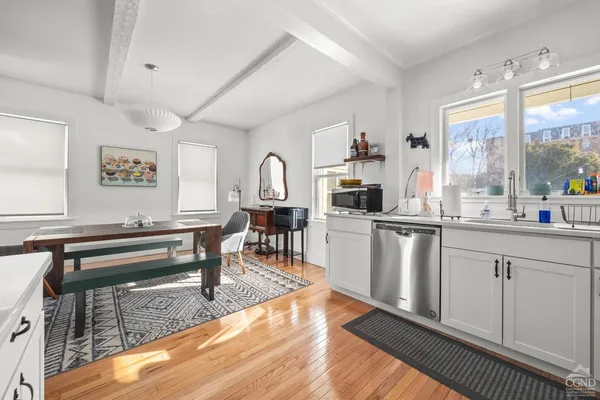 a open kitchen with sink cabinets and window