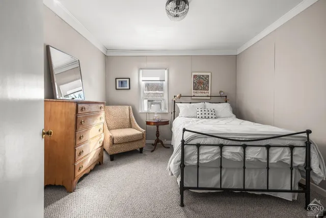 a bedroom with a bed and window