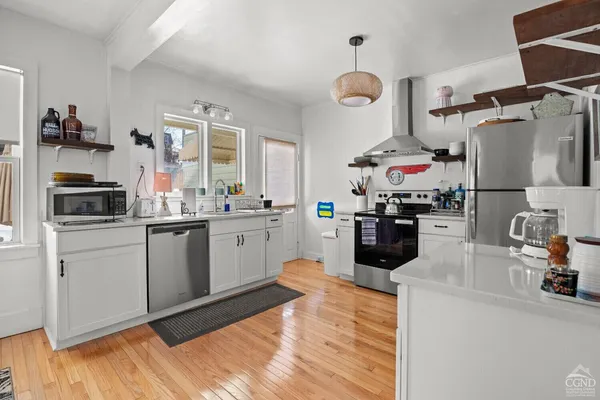 a kitchen with sink cabinets and window