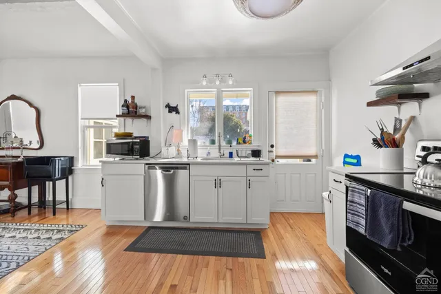 a kitchen with sink cabinets and window
