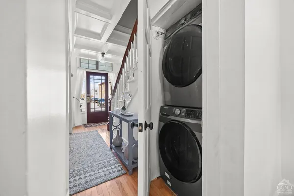 a view of a hallway with washer and dryer