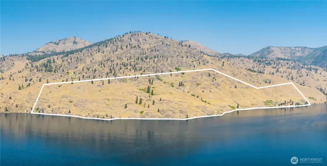 a view of a big room with mountain in the background