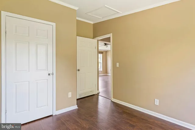 an empty room with wooden floor