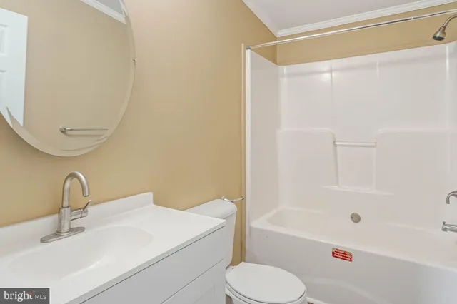 a bathroom with a sink a toilet and a bathtub