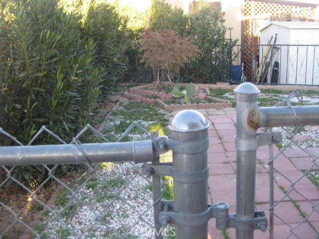 701 Montara Road, Unit 243 Barstow, CA 92311 - Photo 11 of 15 a backyard of a house with outdoor seating