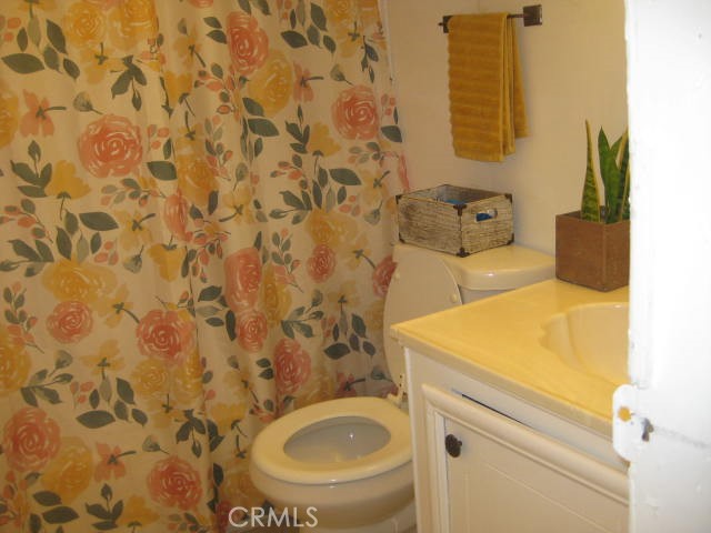 701 Montara Road, Unit 243 Barstow, CA 92311 - Photo 12 of 15 a bathroom with a sink and a toilet