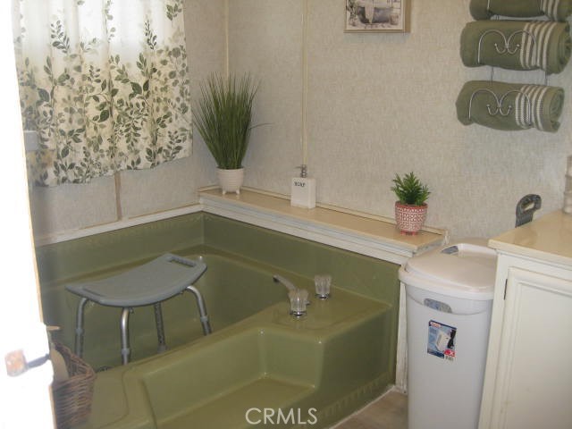 701 Montara Road, Unit 243 Barstow, CA 92311 - Photo 13 of 15 a bathroom with a sink and toilet