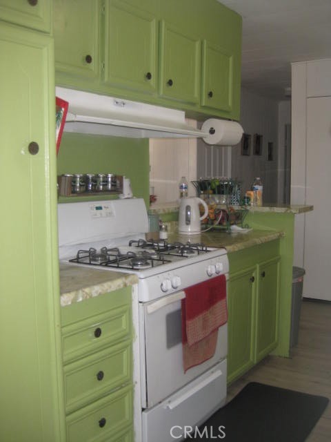 701 Montara Road, Unit 243 Barstow, CA 92311 - Photo 6 of 15 a kitchen with a stove and a sink