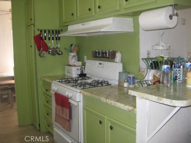 701 Montara Road, Unit 243 Barstow, CA 92311 - Photo 7 of 15 a kitchen with a stove and a sink