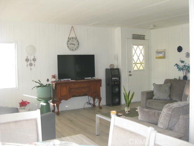701 Montara Road, Unit 243 Barstow, CA 92311 - Photo 8 of 15 a living room with furniture and a flat screen tv