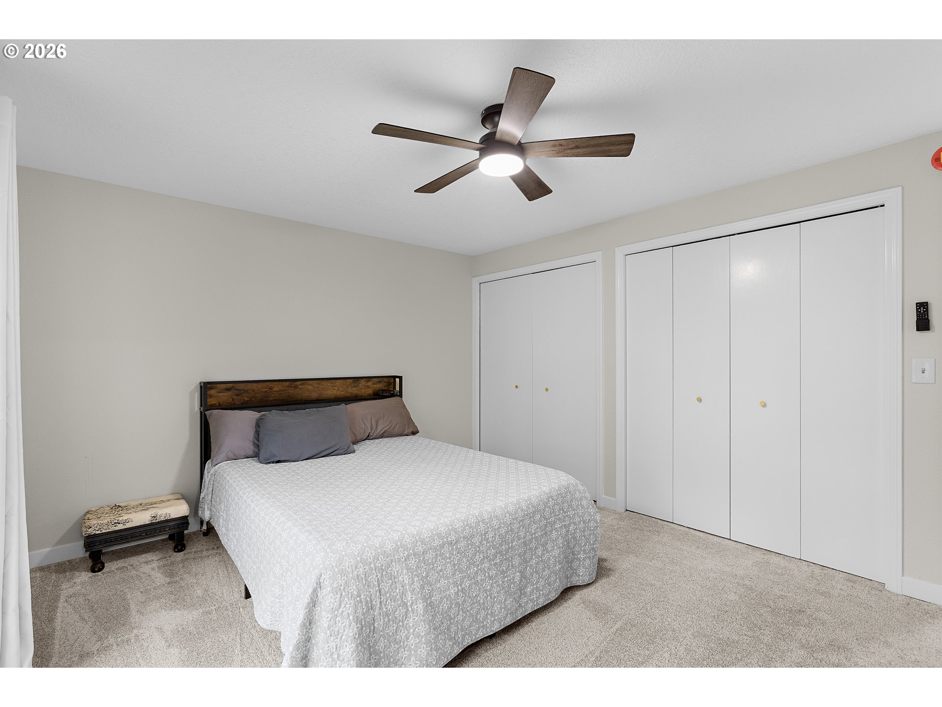 1472 Southwest 14th Street Gresham, OR 97080 - Photo 13 of 40 a bedroom with a bed and a ceiling fan