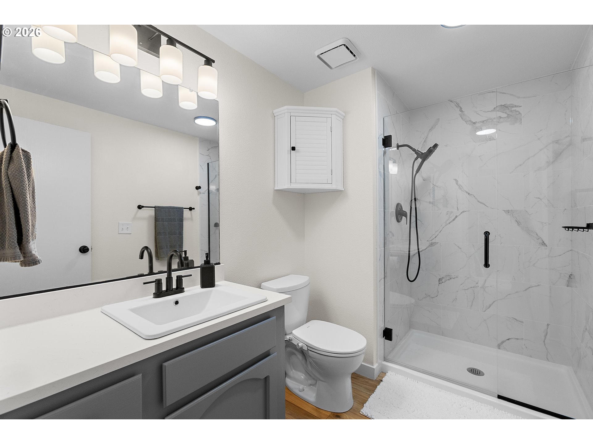 1472 Southwest 14th Street Gresham, OR 97080 - Photo 15 of 40 a bathroom with a sink toilet a mirror and shower