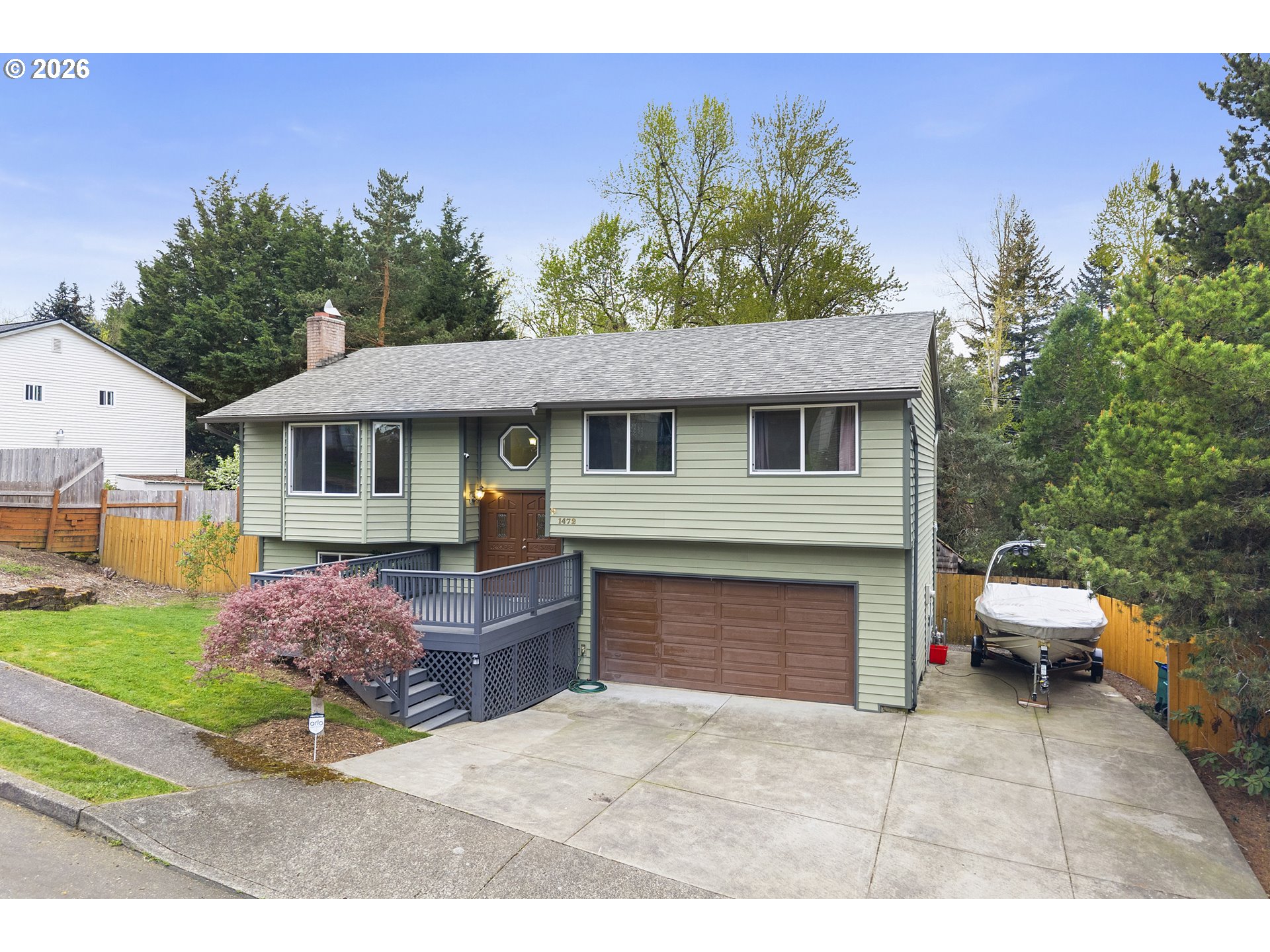 1472 Southwest 14th Street Gresham, OR 97080 - Photo 2 of 40 a front view of a house with a yard and garage
