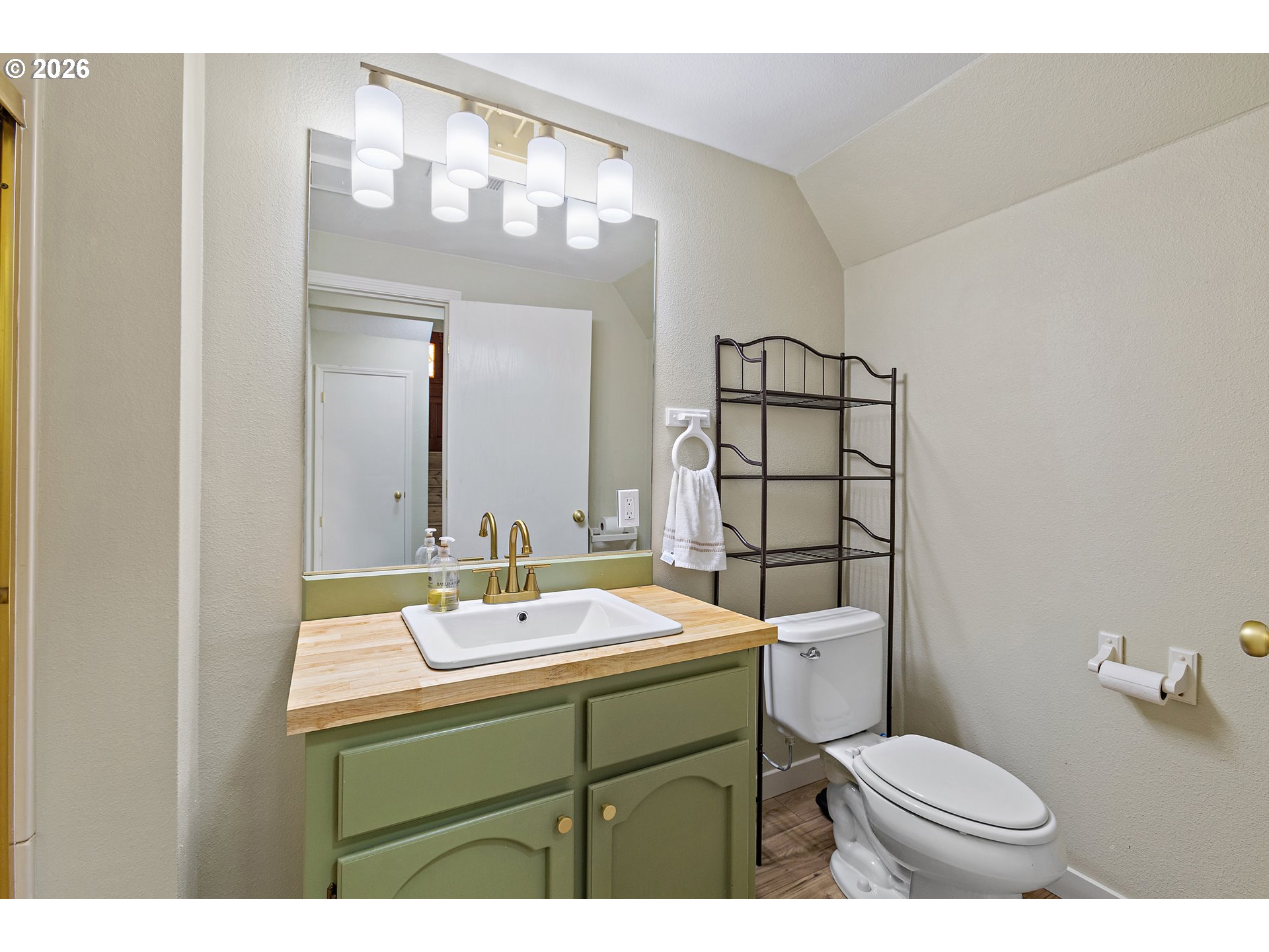 1472 Southwest 14th Street Gresham, OR 97080 - Photo 25 of 40 a bathroom with a sink toilet and mirror